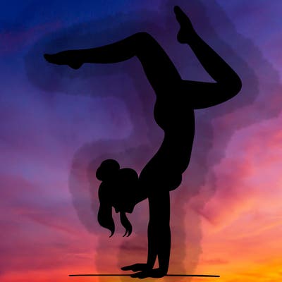 a woman doing a handstand