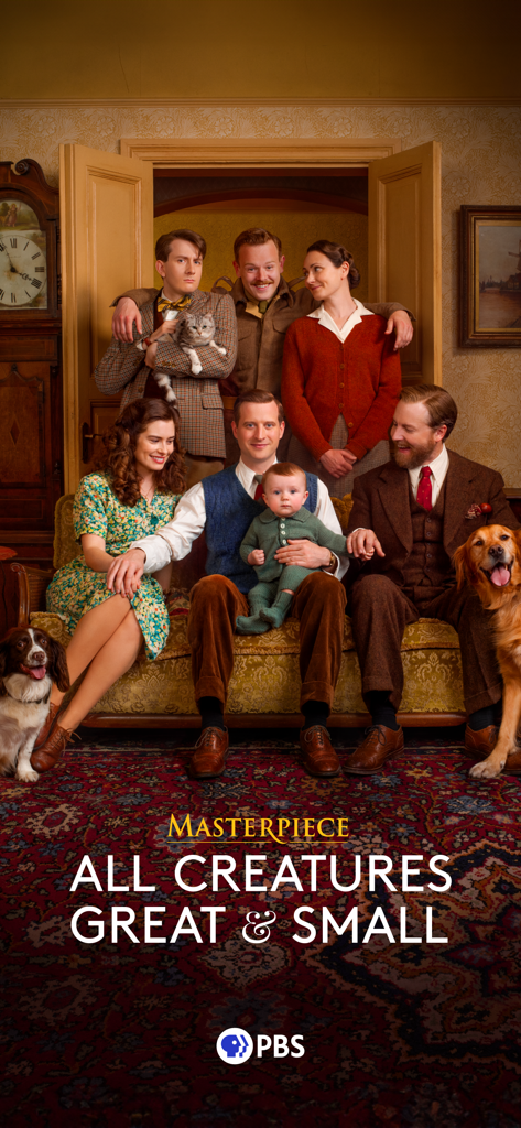 Cast of the PBS Masterpiece series All Creatures Great and Small posing for a family portrait in a vintage room.