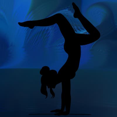 a woman doing a handstand