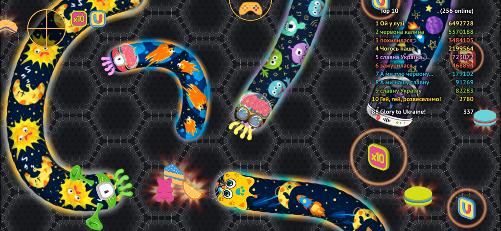 Colorful worms and sweet treats in a multiplayer match of wormate.io with a top 10 leaderboard