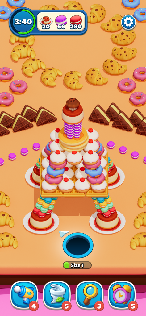A black hole collecting colorful desserts and pastries in the Hole Stars puzzle game