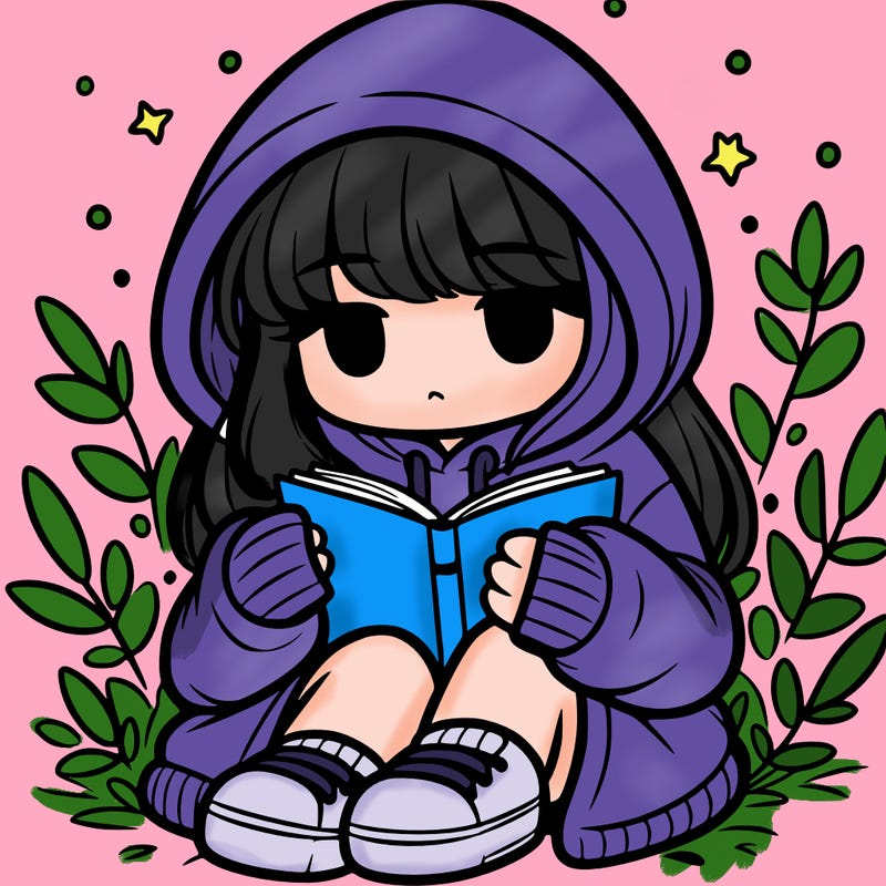 girl in oversized hoodie reading a book