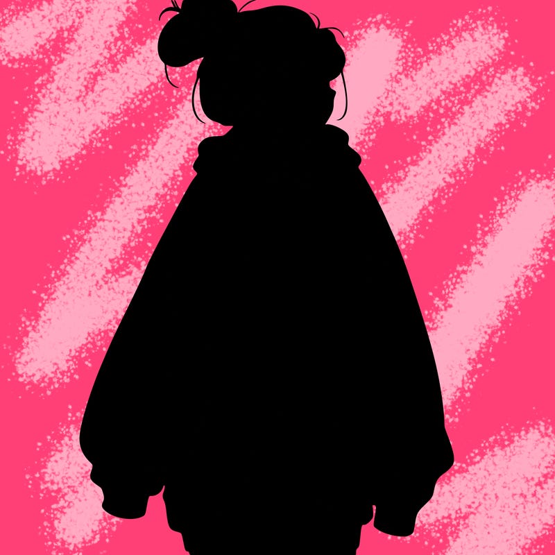 realistic girl with a oversized sweatshirt on and a bun