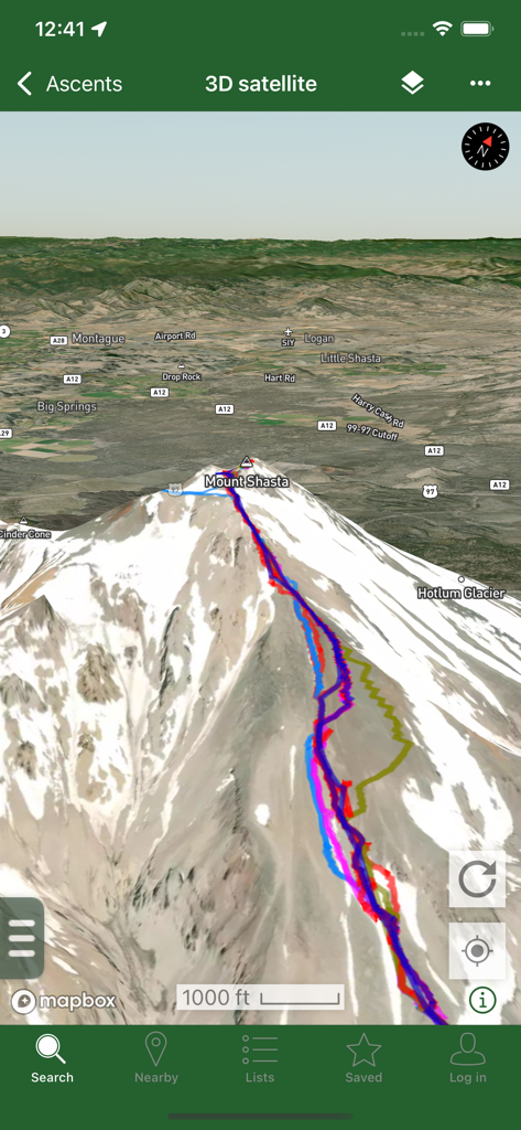 Peakbagger - A 3D satellite map view of Mount Shasta in the Peakbagger app displaying multiple colored GPS tracks for mountain ascents.