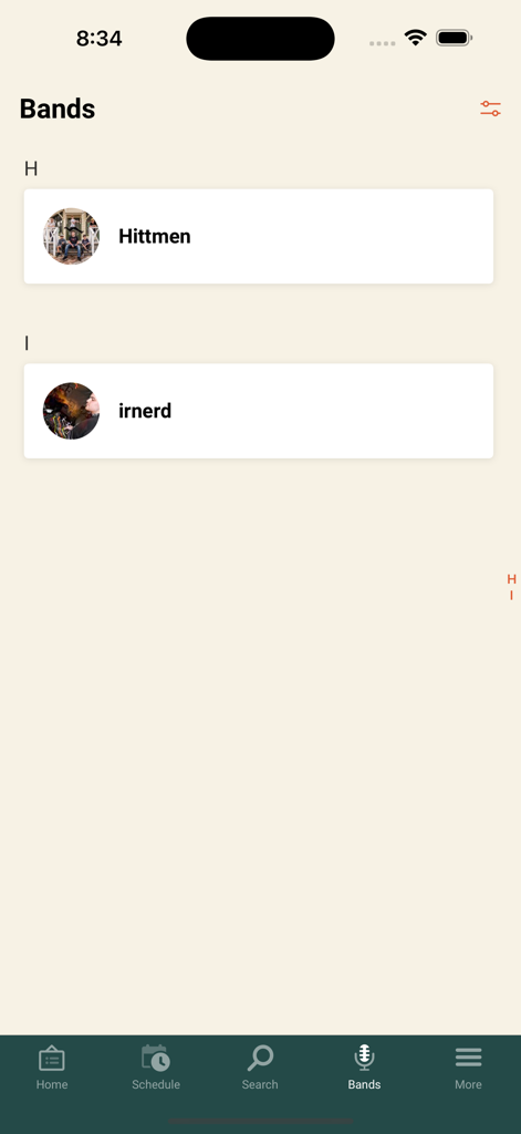 Festival One - Festival One app screen showing a list of performing bands including Hittmen and irnerd with a bottom navigation menu.