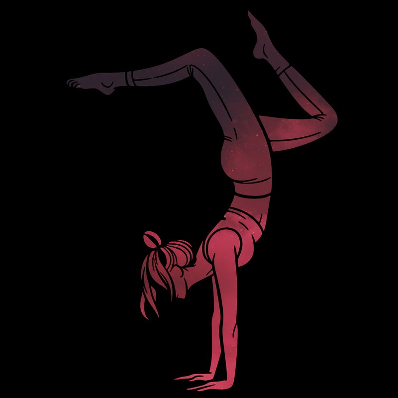 a woman doing a handstand