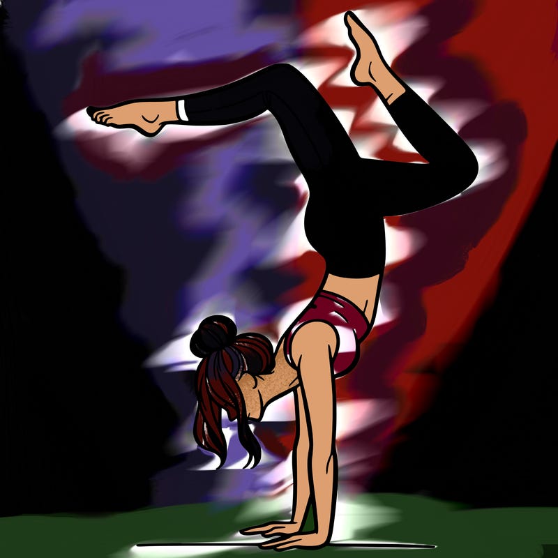 a woman doing a handstand