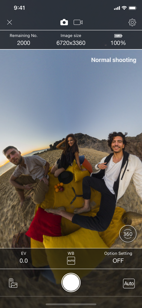 RICOH THETA - The RICOH THETA app interface showing a live 360 degree photo preview of people on a beach.