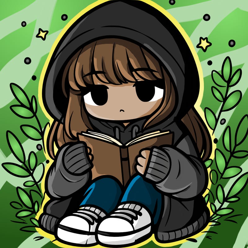 girl in oversized hoodie reading a book