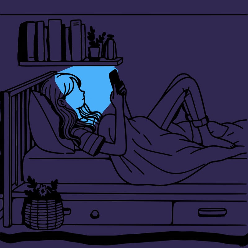 a girl laying on her bed with her phone