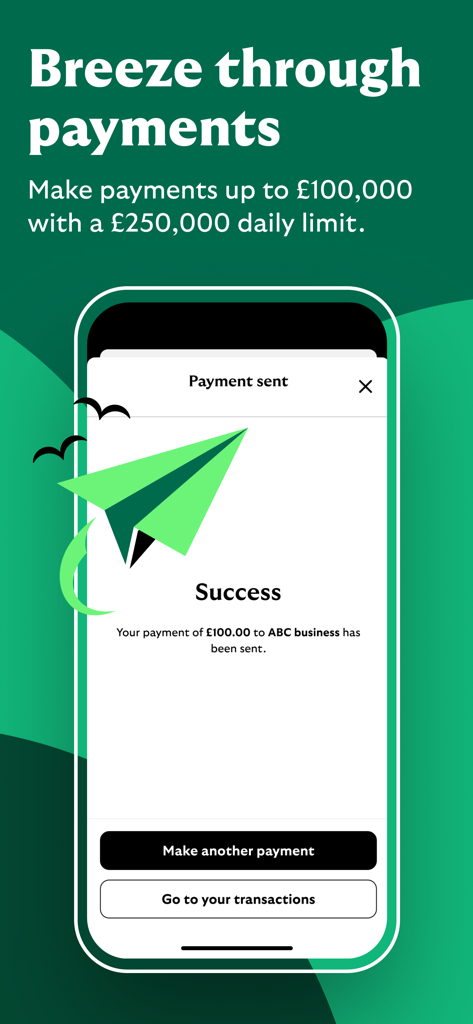 Um smartphone exibindo uma confirmação de pagamento bem-sucedida no aplicativo Lloyds Business Banking com um gráfico de avião de papel verde
