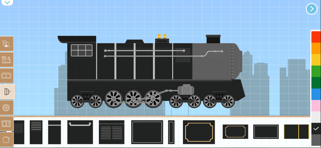 A black steam locomotive being built in a digital brick construction app for kids