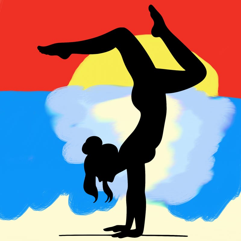 a woman doing a handstand