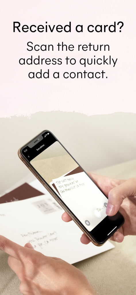 Minted: The Address Book - A person using the Minted app on an iPhone to scan a return address from a physical envelope to automatically save a new contact.