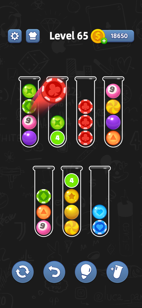 A gameplay screenshot of Ball Sort showing various colorful poker chip style balls being sorted into glass tubes on Level 65.