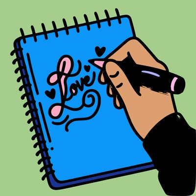 a hand writing “love” in calligraphy on a notebook
