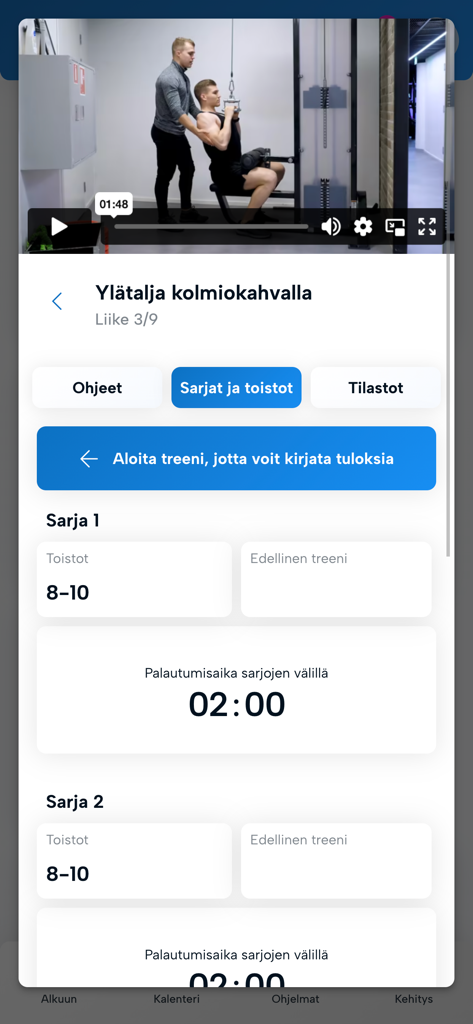 Versus Valmennus - Versus Valmennus app workout tracker showing lat pulldown exercise video and set logs