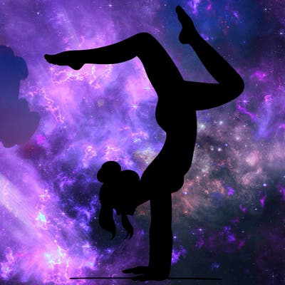 a woman doing a handstand