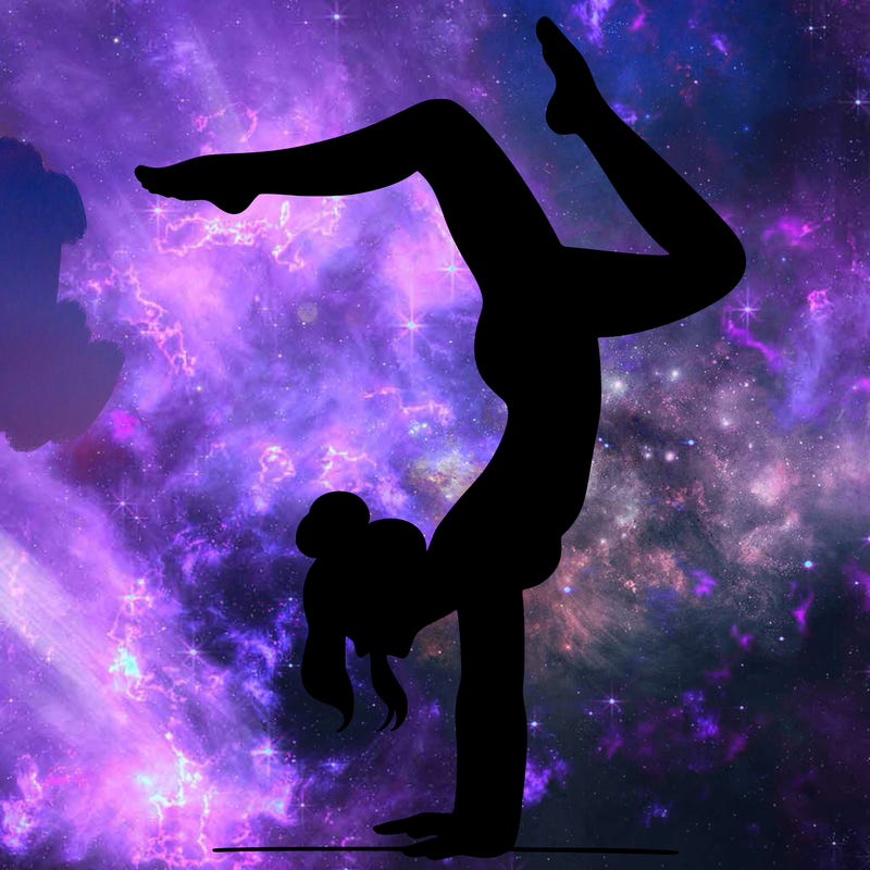 a woman doing a handstand