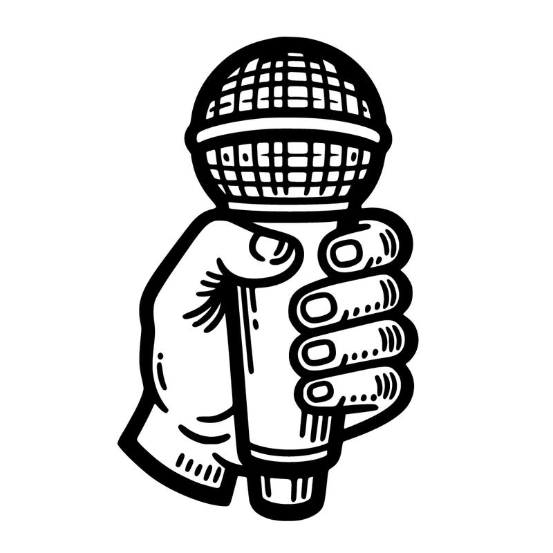 a hand holding a microphone