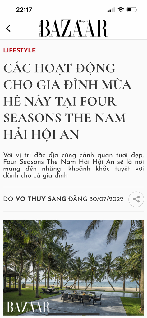 Harper's Bazaar VN - A screenshot of the Harper's Bazaar Vietnam app featuring a lifestyle article about summer family activities at a luxury resort in Hoi An