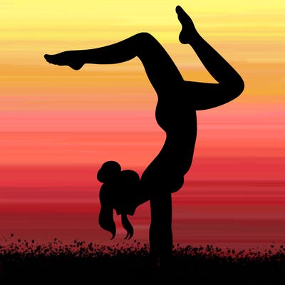 a woman doing a handstand
