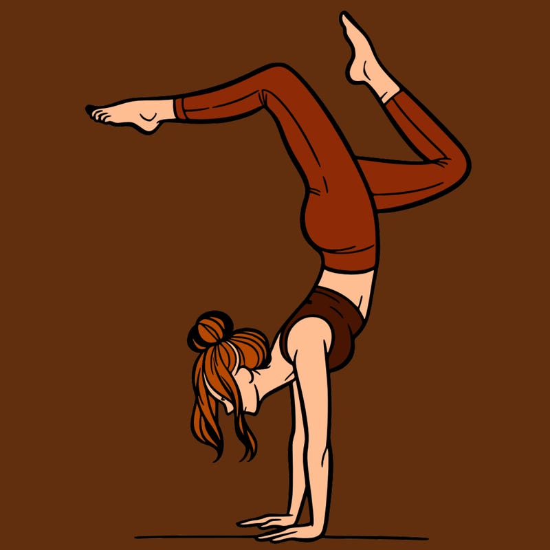 a woman doing a handstand
