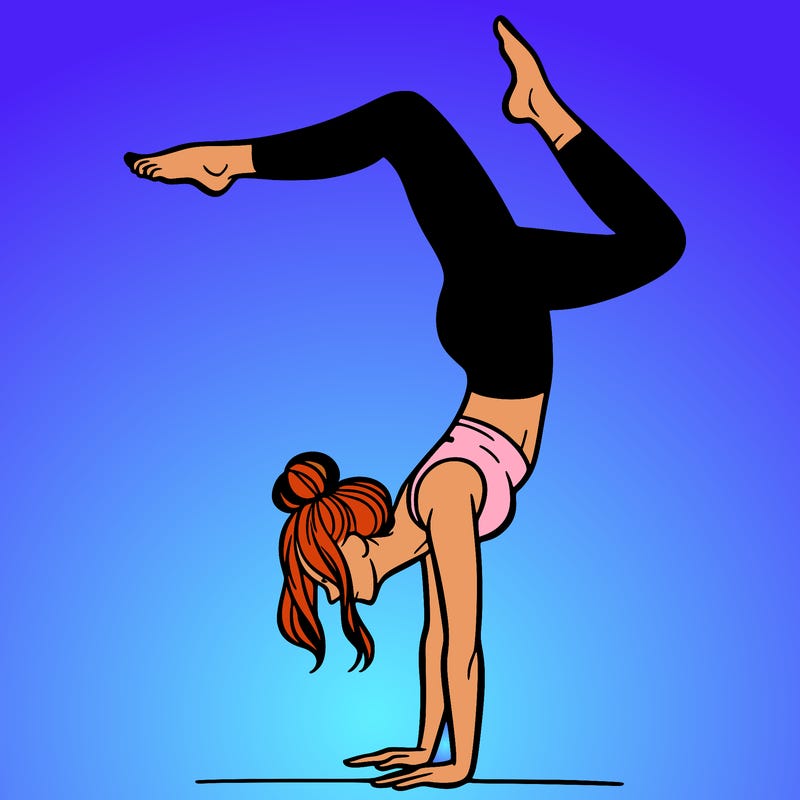 a woman doing a handstand
