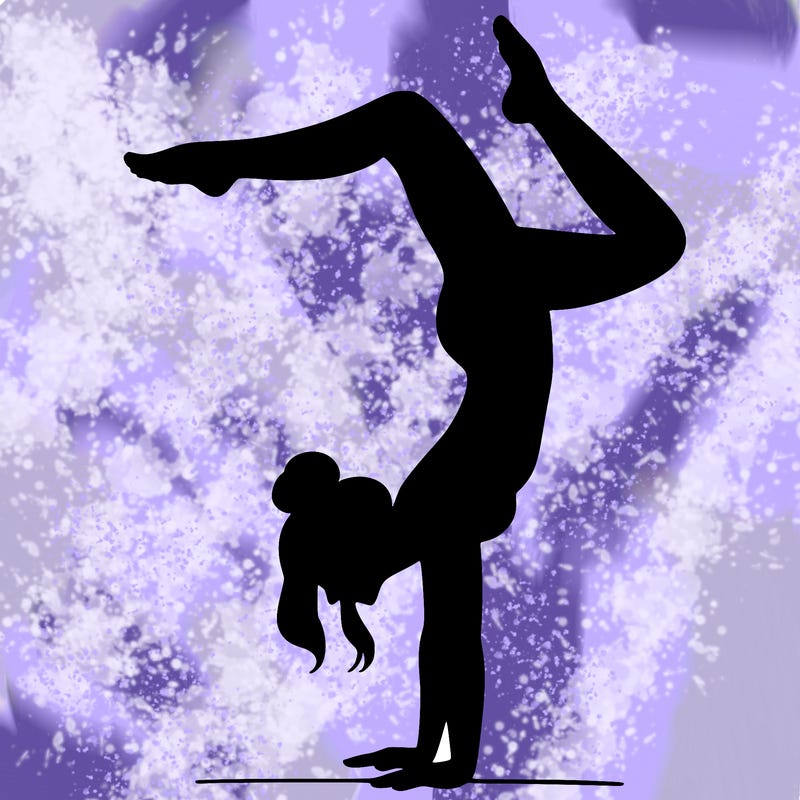a woman doing a handstand
