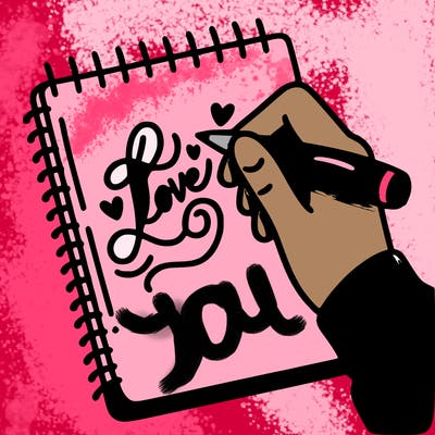 a hand writing “love” in calligraphy on a notebook