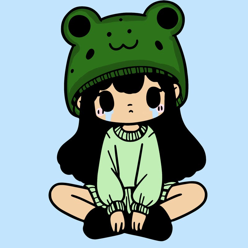a girl wearing a frog hat and some frog socks