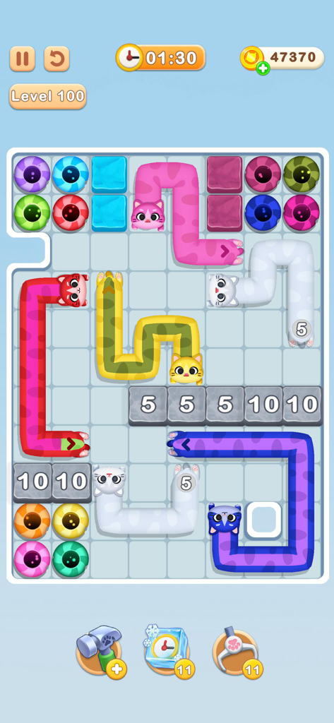 Cat me out - Gameplay of Cat me out showing colorful long cats matching with same colored holes on a grid