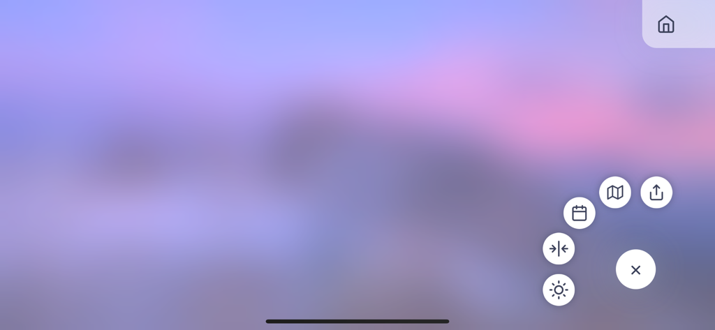 Roundshot Livecam - A blurred panoramic sky view with navigation icons for map, calendar, and brightness settings in the Roundshot Livecam app.