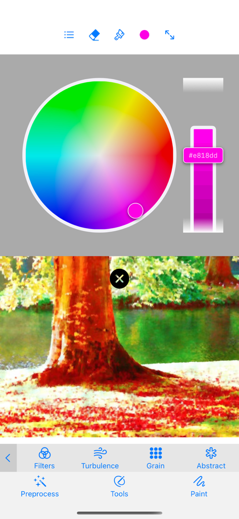 Monet - photo to pastel - Interface of Monet app showing a circular color wheel and a landscape photo with an impressionist painting filter applied