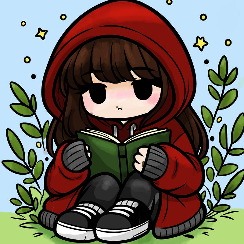 girl in oversized hoodie reading a book