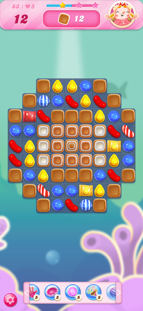 Candy Crush Saga gameplay screen showing a match 3 puzzle board with colorful candies and level objectives