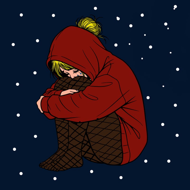 girl crying with hoodie over her hair and hair in bun