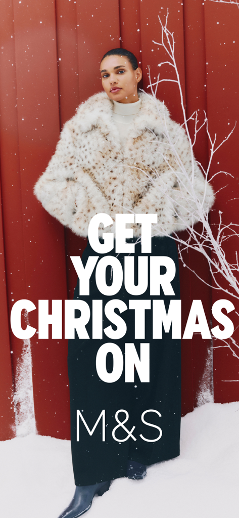 Woman wearing a white faux fur jacket for M&S Christmas campaign
