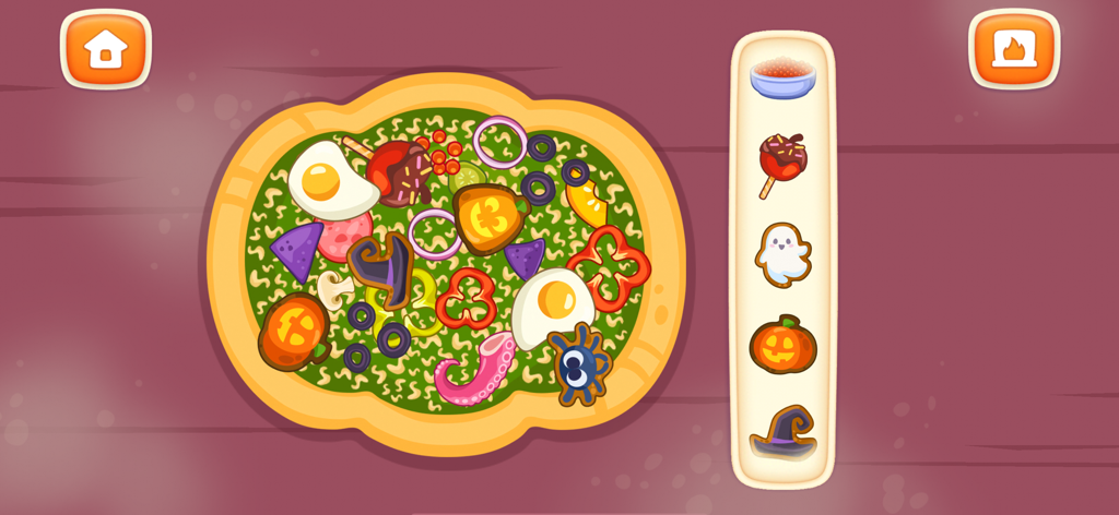 Pizza Maker: Kids Cooking Game - Decorating a Halloween themed pizza in the Pizza Maker kids cooking game