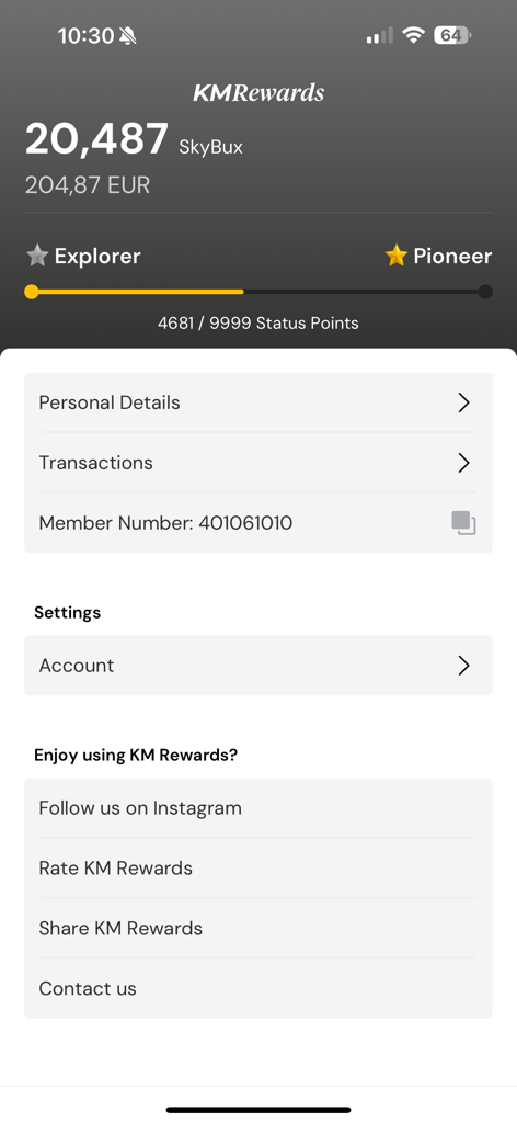 KM Rewards - KM Rewards app dashboard showing SkyBux balance and status point progression