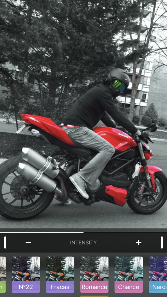 Color Accent - A red motorcycle highlighted against a black and white background in the Color Accent photo editor