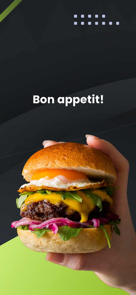 A hand holding a fresh gourmet burger with a fried egg and melted cheese