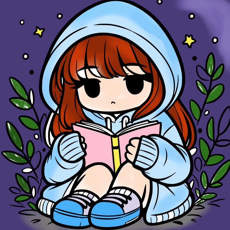 girl in oversized hoodie reading a book