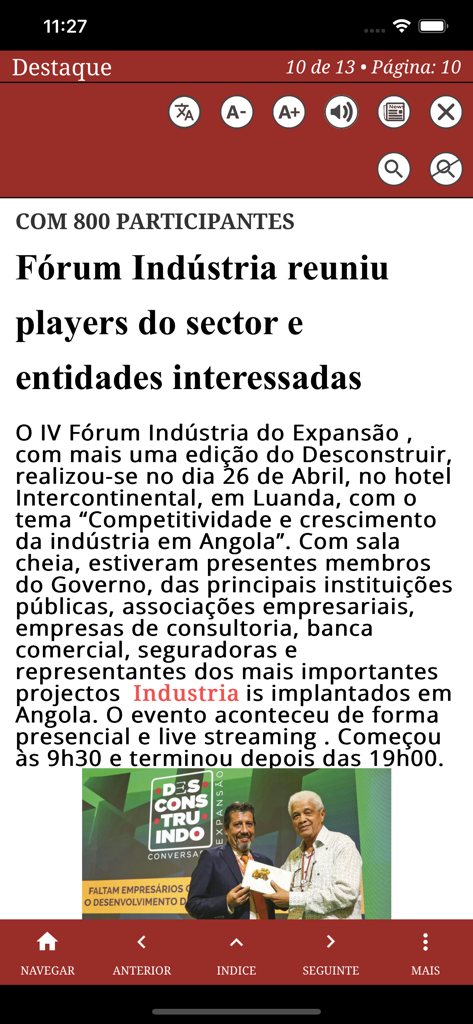Un artículo de noticias sobre un foro industrial en Luanda mostrado en la aplicación Quiosque Nova Vaga con funciones de accesibilidad