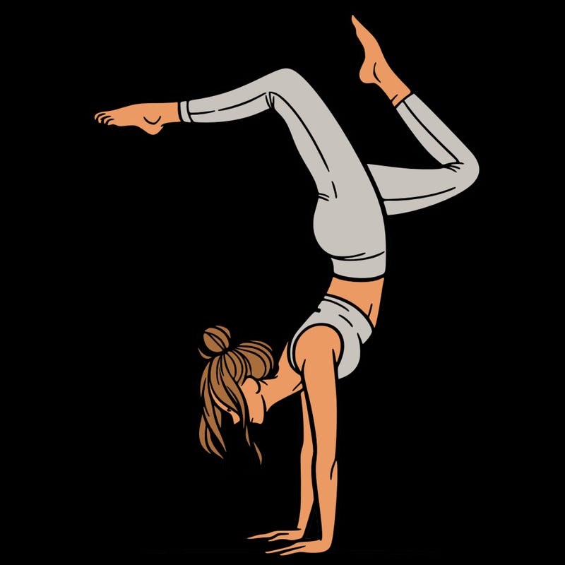 a woman doing a handstand