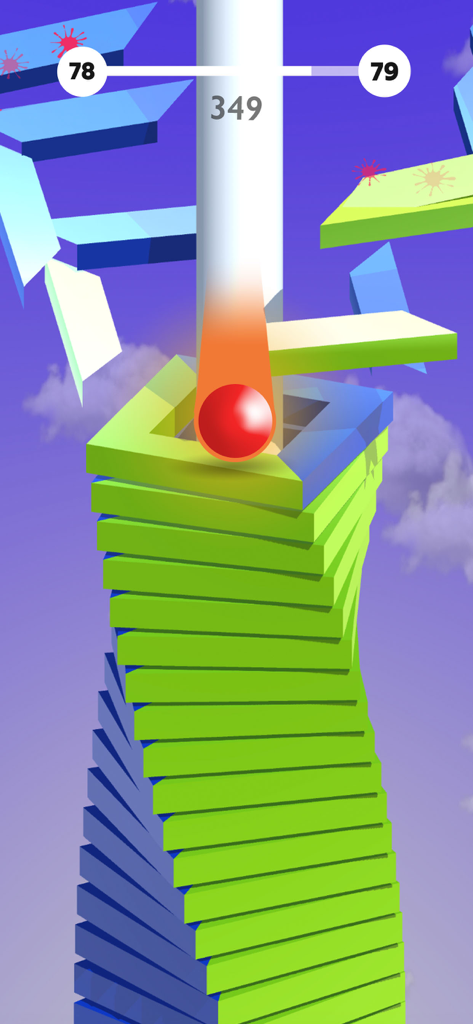 Una bola roja saltando a través de una torre de plataformas espiral colorida en Jump Start Bounzy Ballz.