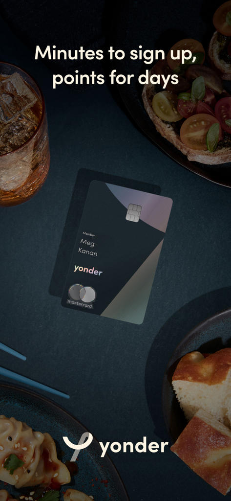 Yonder Rewards Cards - Yonder rewards card on a table with premium dining and gourmet food