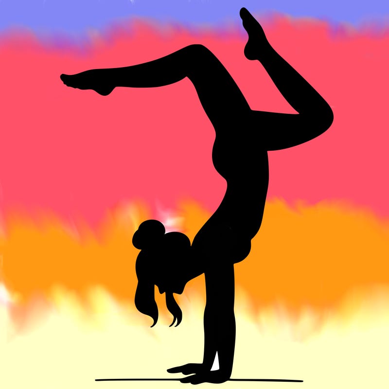 a woman doing a handstand