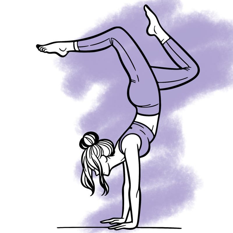 a woman doing a handstand
