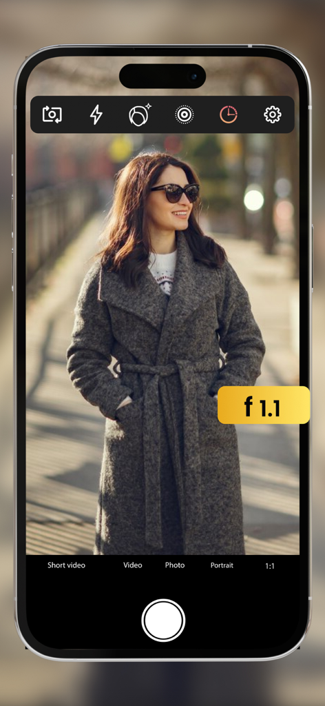 Pro Camera with RAW & Focus - iPhone interface of Pro Camera app showing a woman in portrait mode with f 1.1 manual aperture setting